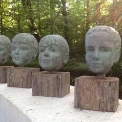 Vier portretten, brons